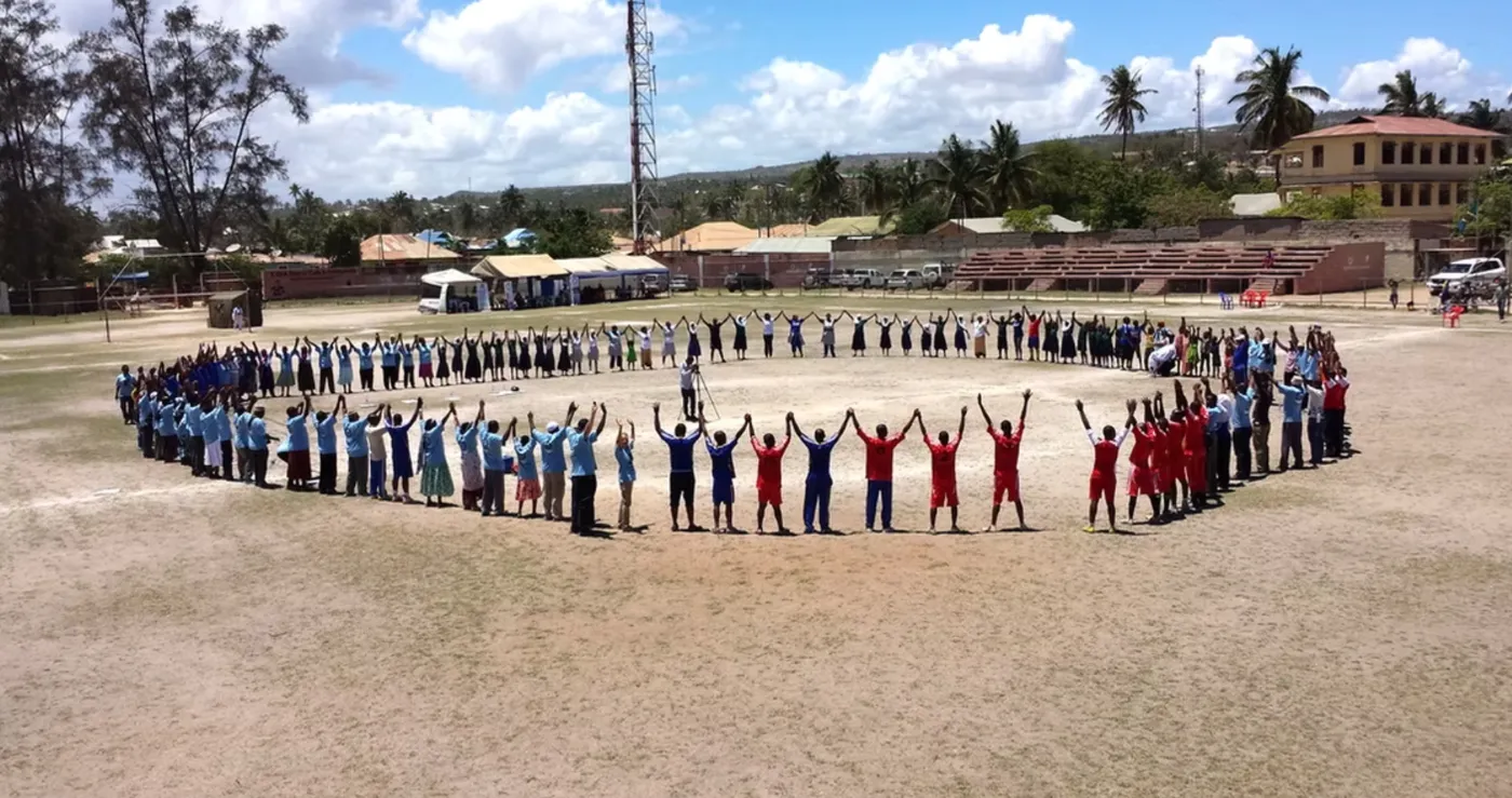 A solidarity circle on the sports field in Lindi, World Diabetes Day